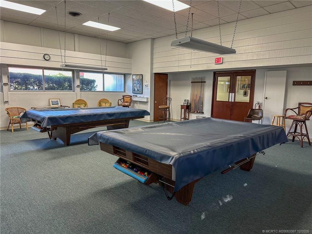 2600 Southeast Ocean Boulevard, Unit II1 Stuart, FL 34996 - Photo 37 of 38 a bedroom with a bed a table and chairs