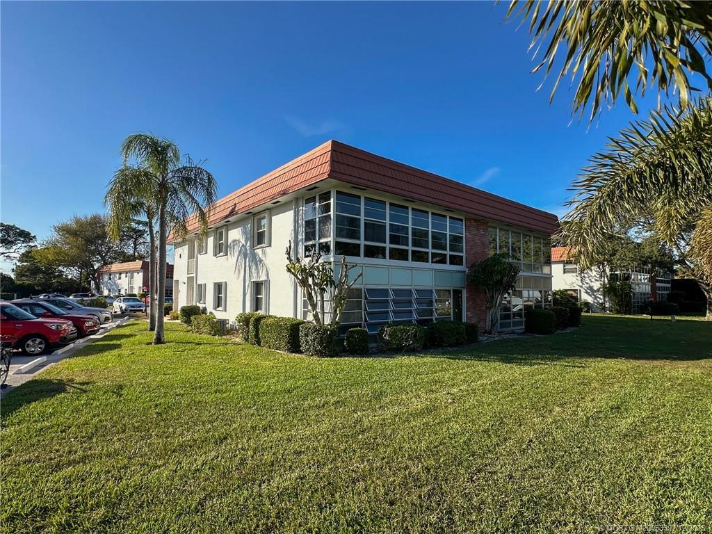 2600 Southeast Ocean Boulevard, Unit II1 Stuart, FL 34996 - Photo 5 of 38 a view of a house with a yard