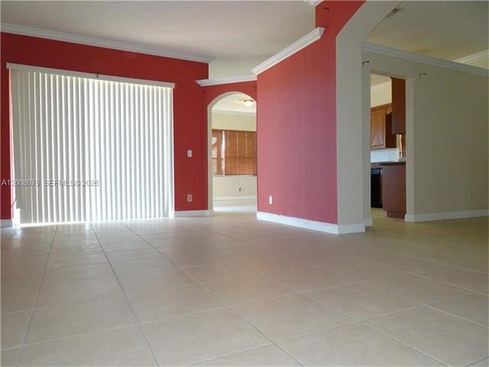 12830 Southwest 51st Street Miramar, FL 33027 - Photo 3 of 7 a view of empty room with window