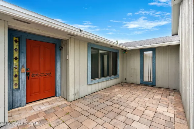 a living room with a fireplace and a wooden floor