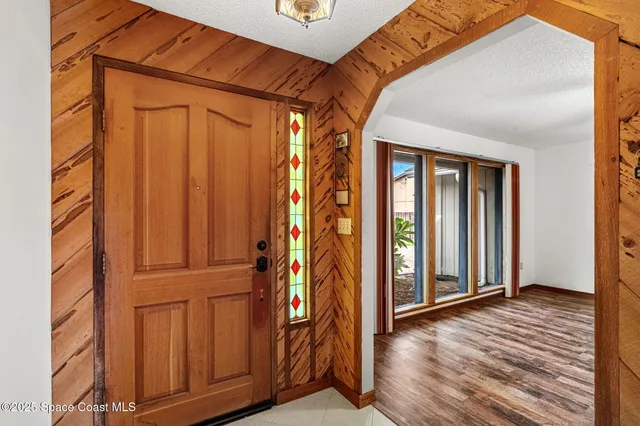 a kitchen with stainless steel appliances a refrigerator sink and microwave