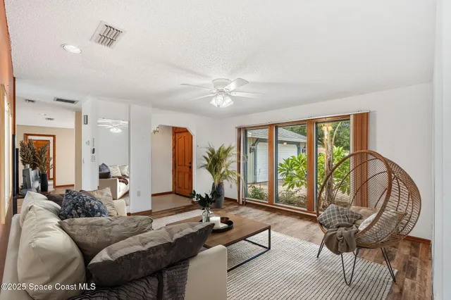 a kitchen with stainless steel appliances granite countertop a refrigerator a stove and a microwave