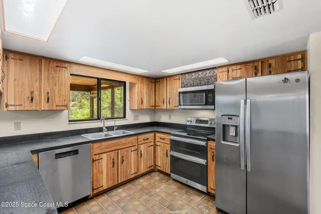 a bathroom with a double vanity sink double mirror and bathtub