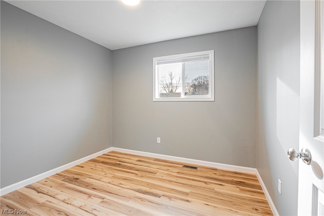 1367 Arcadia Road Kent, OH 44240 - Photo 14 of 20 Unfurnished room with light wood-type flooring
