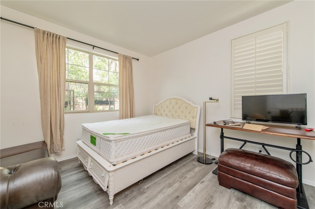 579 Boxwood Lane Azusa, CA 91702 - Photo 20 of 27 a bedroom with a bed and a flat screen tv