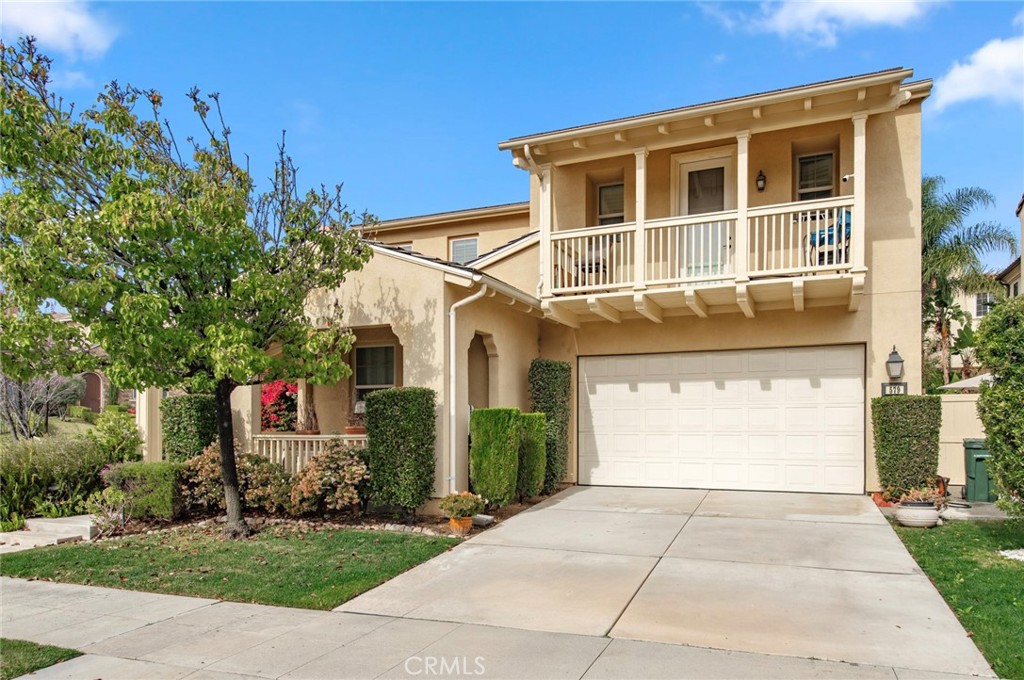 579 Boxwood Lane Azusa, CA 91702 - Photo 2 of 27 a front view of a house with a yard and a garage