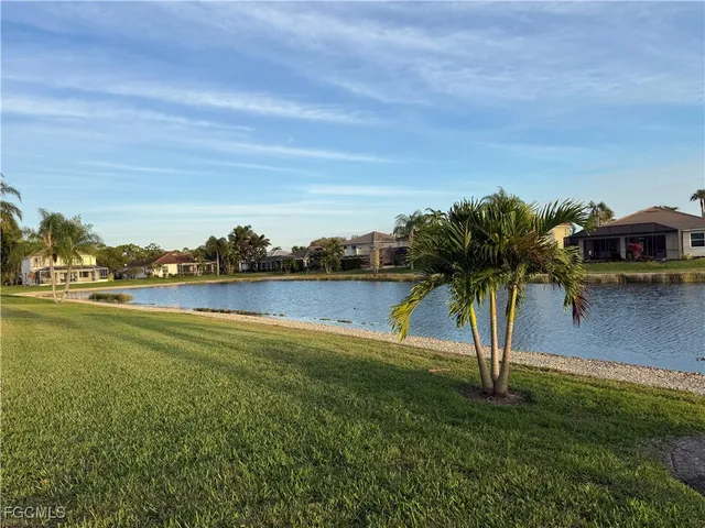 a view of a lake with a yard