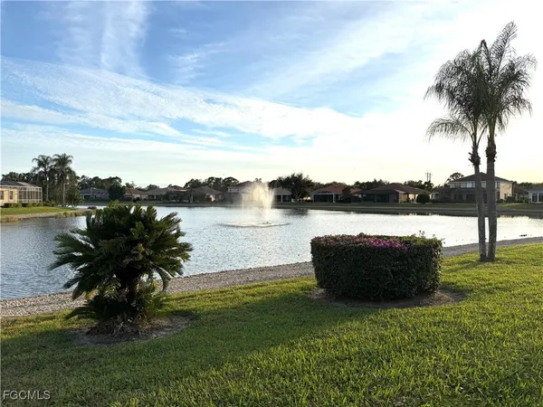 a lake view with a big yard