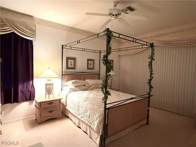 a bed room with a bed and a window