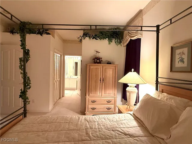 a view of a room with a furniture and a window