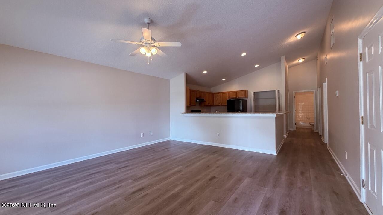 8678 Sibbald Road Jacksonville, FL 32208 - Photo 21 of 24 a view of a kitchen with wooden floor and a kitchen