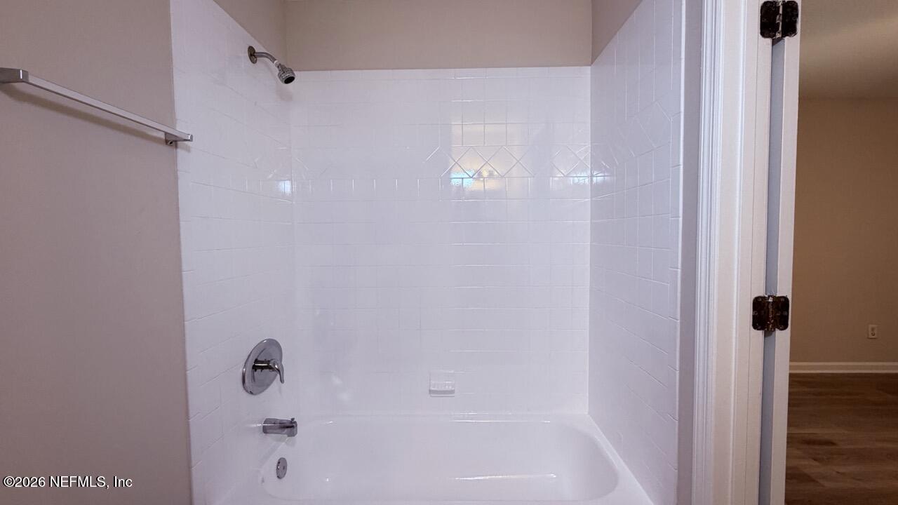 8678 Sibbald Road Jacksonville, FL 32208 - Photo 23 of 24 a bathroom with a shower