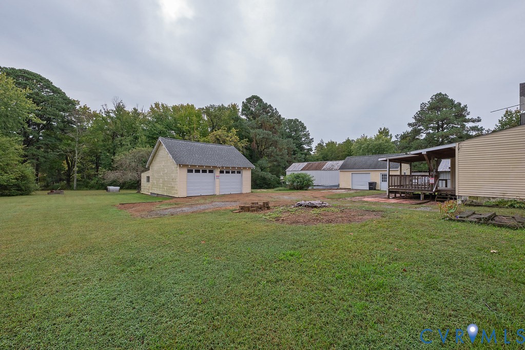 1881 Fairport Road Reedville, VA 22539 - Photo 22 of 54 Expansive grassy lot featuring mature trees, a det