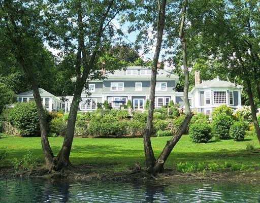 61 Musketaquid Road Concord, MA 01742 - Photo 18 of 19 a view of a house with a yard and a large tree