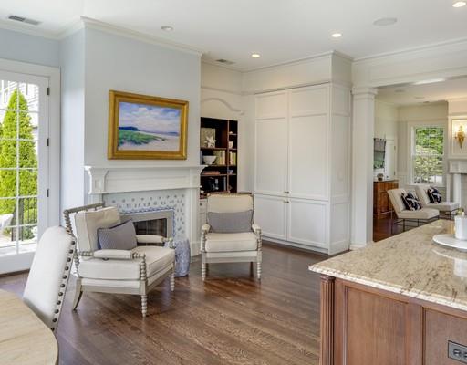 61 Musketaquid Road Concord, MA 01742 - Photo 4 of 19 a living room with furniture a fireplace and a large window