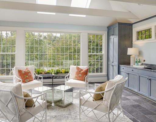 61 Musketaquid Road Concord, MA 01742 - Photo 9 of 19 a dining room with furniture and large windows