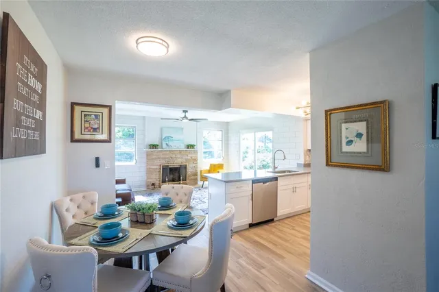 a view of a dining room with furniture window and wooden floor