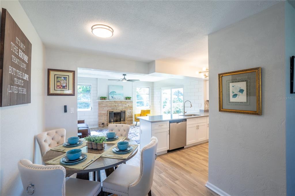 24 Berkley Road Ormond Beach, FL 32176 - Photo 15 of 44 a view of a dining room with furniture window and wooden floor