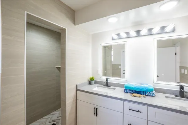 a bathroom with a sink and a mirror