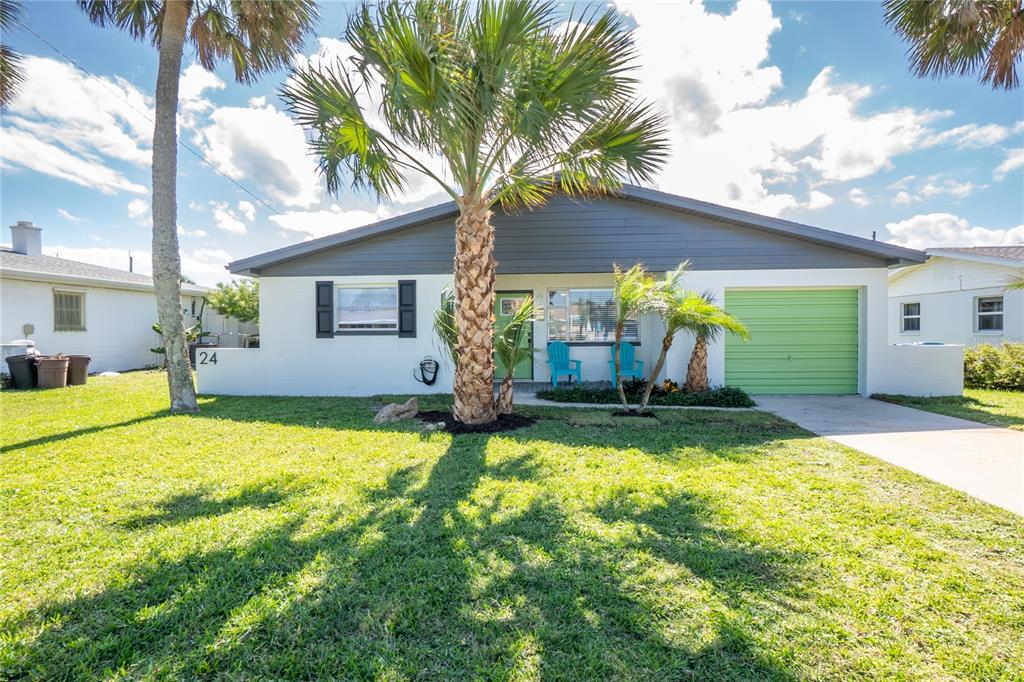 24 Berkley Road Ormond Beach, FL 32176 - Photo 2 of 44 a view of a house with swimming pool and a yard