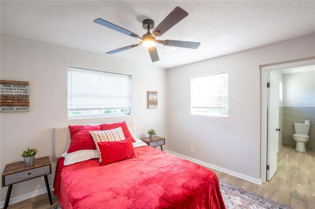 24 Berkley Road Ormond Beach, FL 32176 - Photo 21 of 44 a bedroom with a large bed and a window