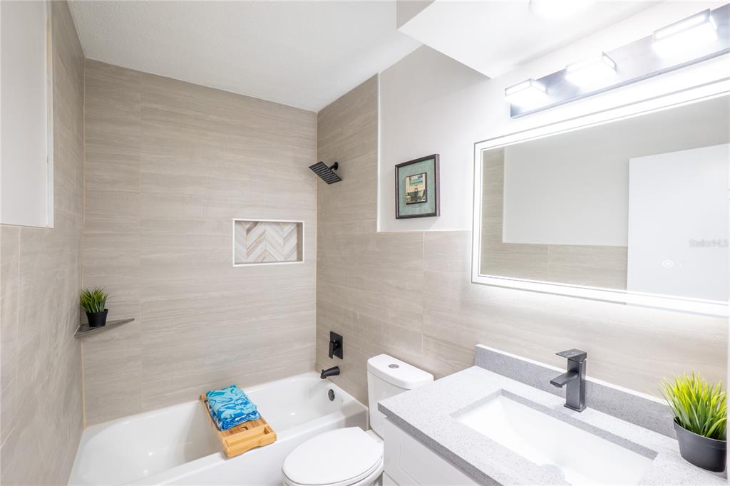 24 Berkley Road Ormond Beach, FL 32176 - Photo 22 of 44 a bathroom with a sink and a mirror