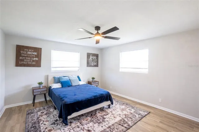 a living room with furniture rug and a window