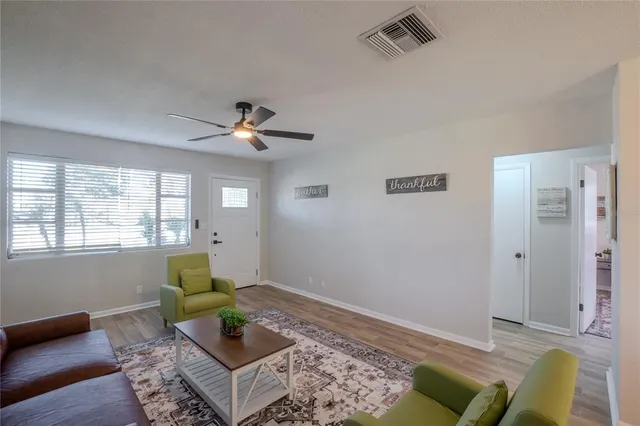 a living room with furniture and a window
