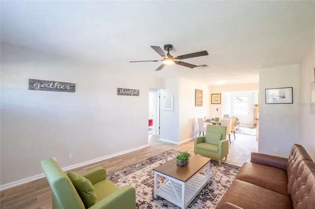 a living room with furniture and a table