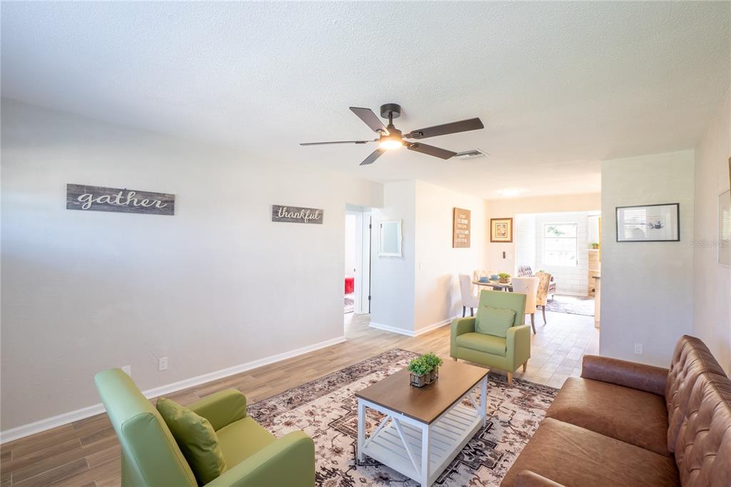 24 Berkley Road Ormond Beach, FL 32176 - Photo 27 of 44 a living room with furniture and a table