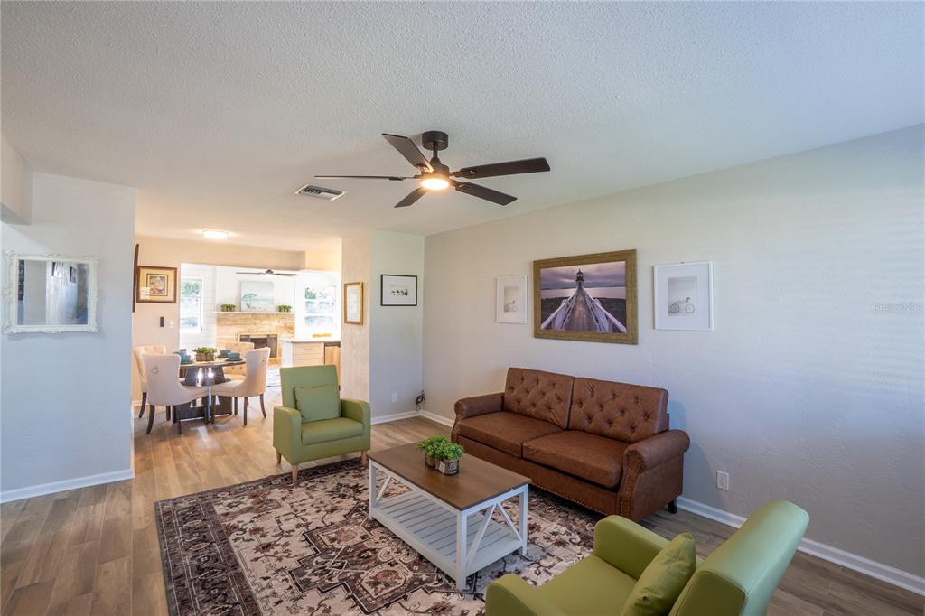 24 Berkley Road Ormond Beach, FL 32176 - Photo 28 of 44 a living room with furniture and a wooden floor