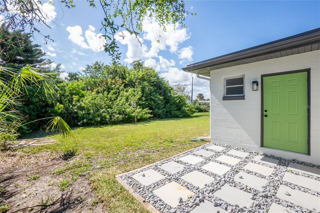 24 Berkley Road Ormond Beach, FL 32176 - Photo 32 of 44 a view of a backyard of the house