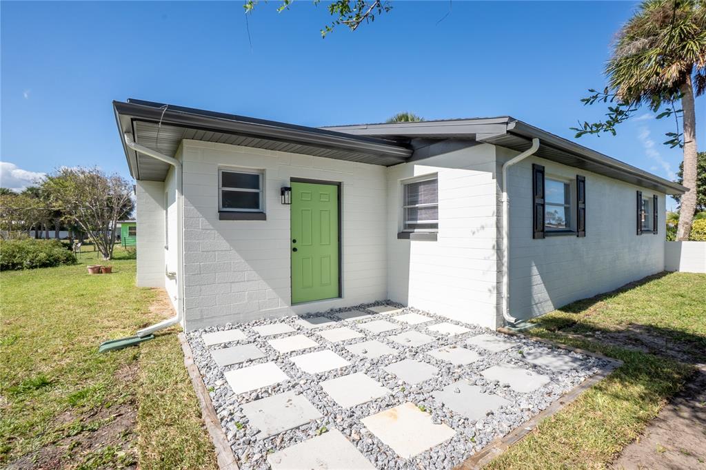 24 Berkley Road Ormond Beach, FL 32176 - Photo 34 of 44 a view of a house with a yard