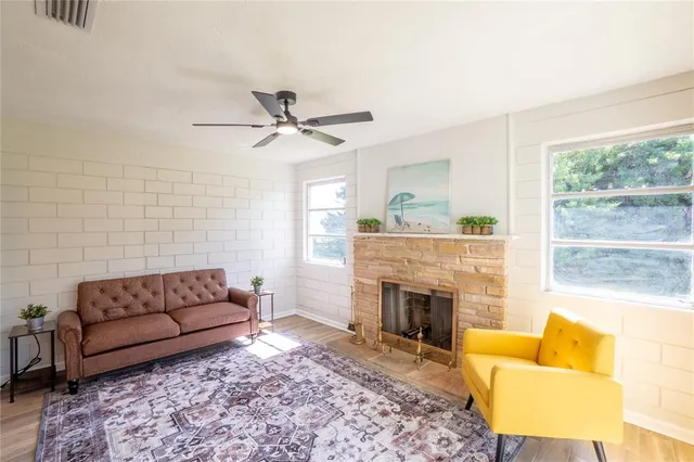 a living room with furniture and a fireplace