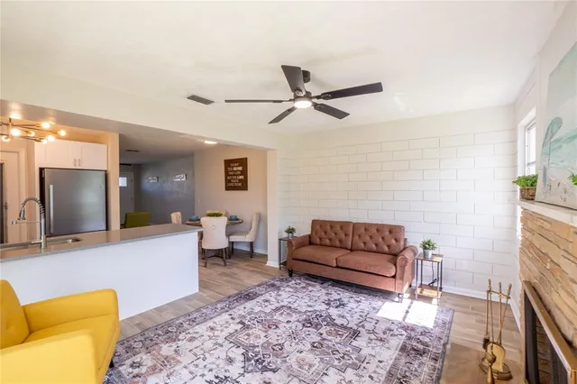 a living room with furniture and a rug