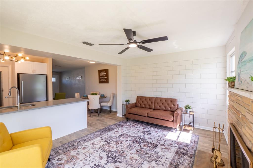 24 Berkley Road Ormond Beach, FL 32176 - Photo 6 of 44 a living room with furniture and a rug
