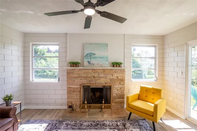 a living room with furniture and a fireplace