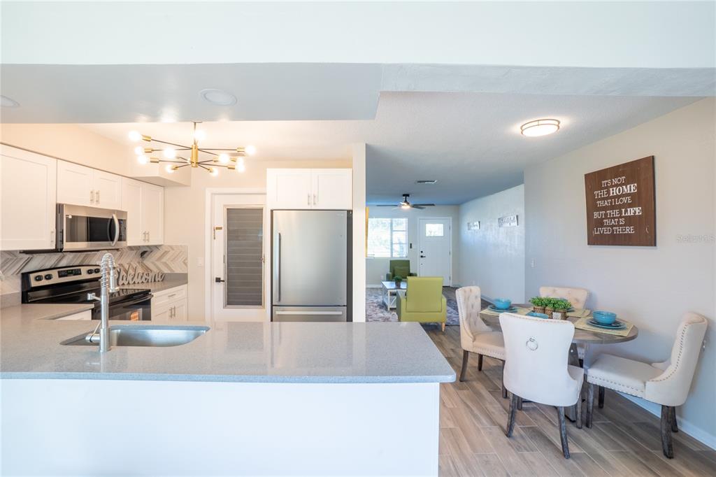 24 Berkley Road Ormond Beach, FL 32176 - Photo 9 of 44 a view of a dining room with furniture