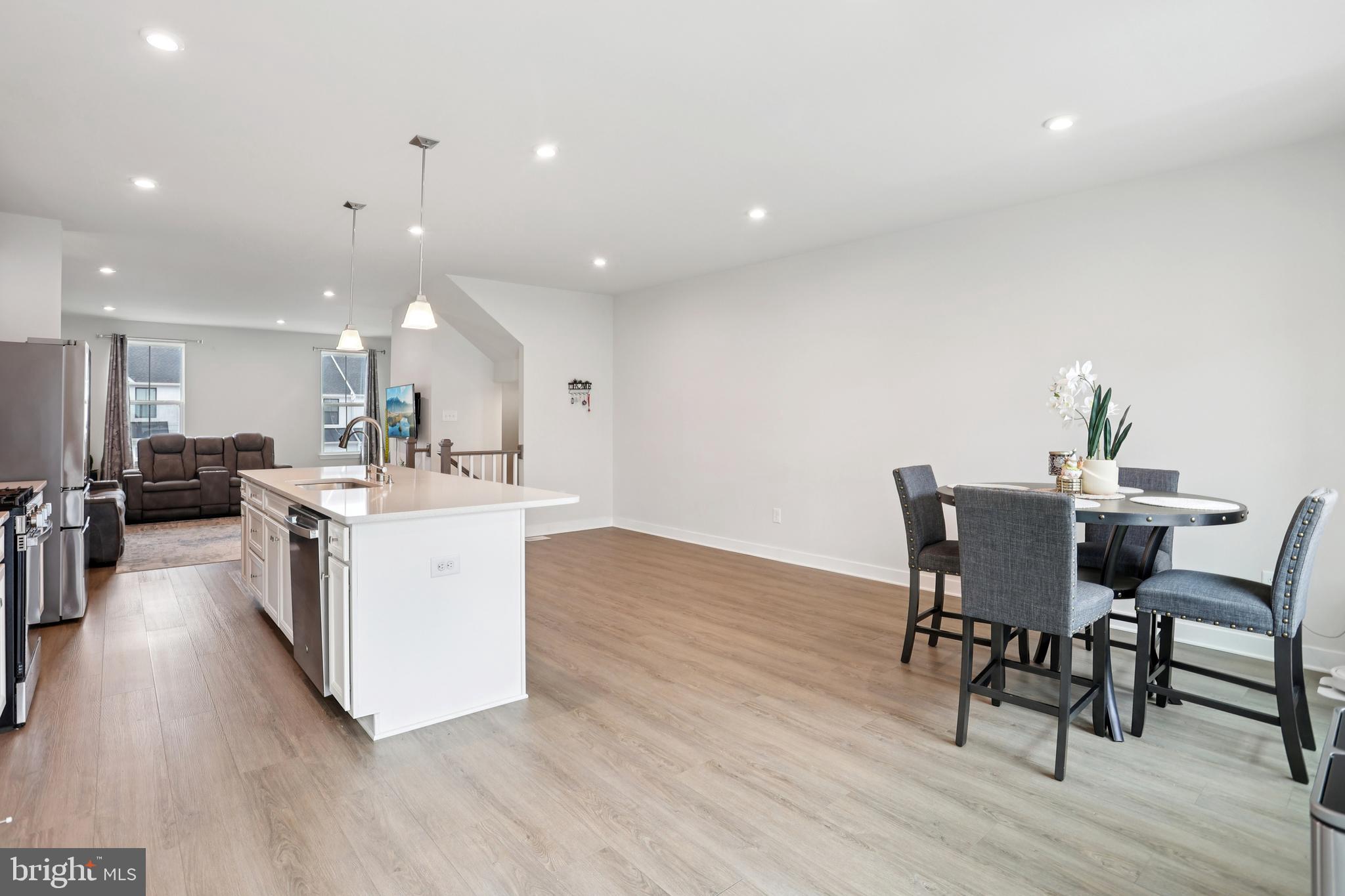 47 Rosemary Way Mount Laurel, NJ 08054 - Photo 10 of 47 a kitchen with a dining table chairs and wooden floor