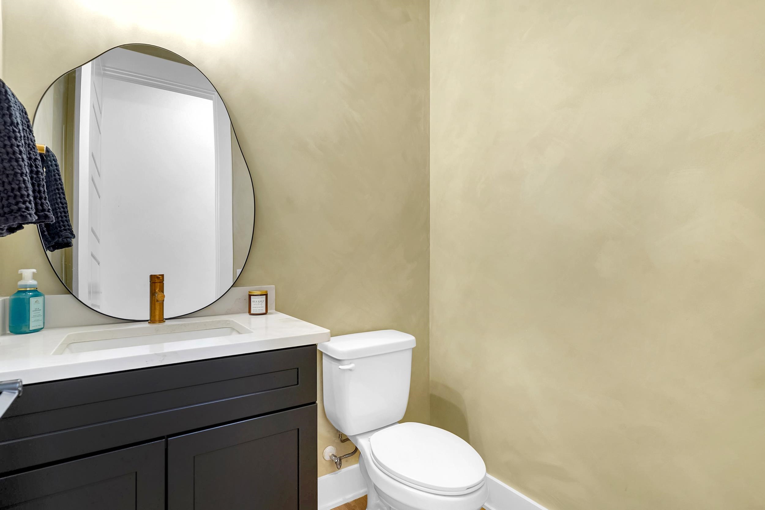 64 Oak Cluster Lane St. Augustine, FL 32092 - Photo 10 of 59 a bathroom with a toilet a sink and mirror