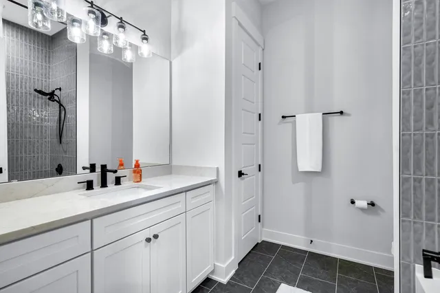 a bathroom with a sink and a mirror
