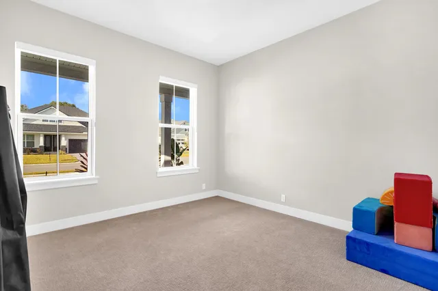 a bed room with a bed and a window