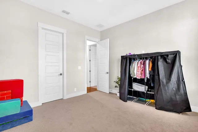 a bedroom with two beds and a large window