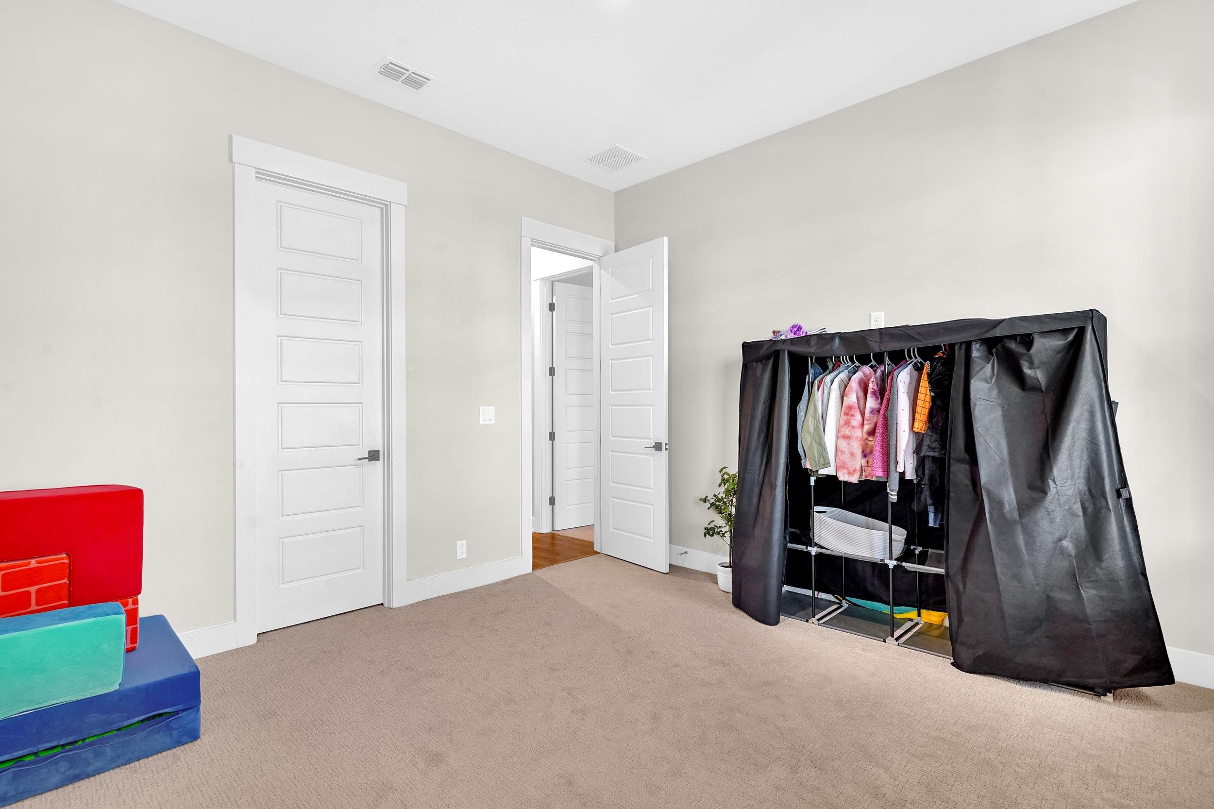 64 Oak Cluster Lane St. Augustine, FL 32092 - Photo 15 of 59 a bed room with a bed and a window