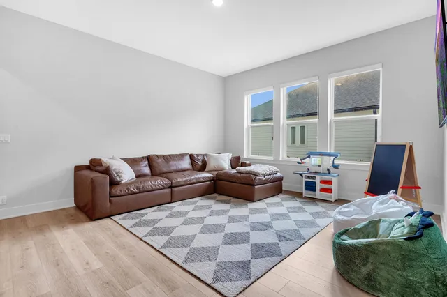a living room with furniture and windows