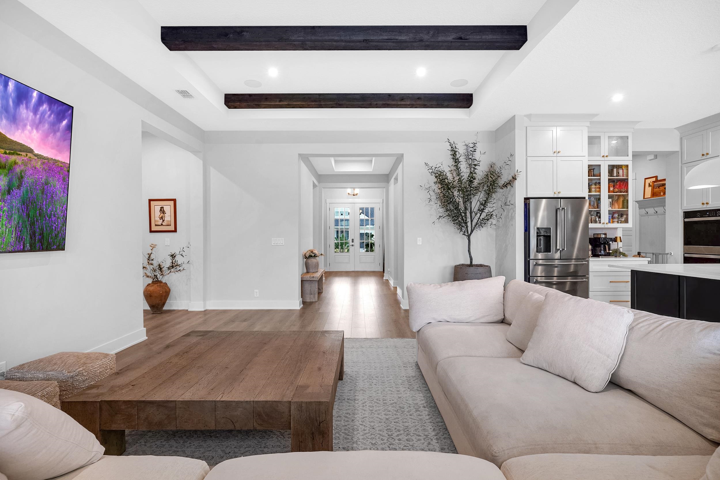 64 Oak Cluster Lane St. Augustine, FL 32092 - Photo 22 of 59 a living room with furniture and a chandelier