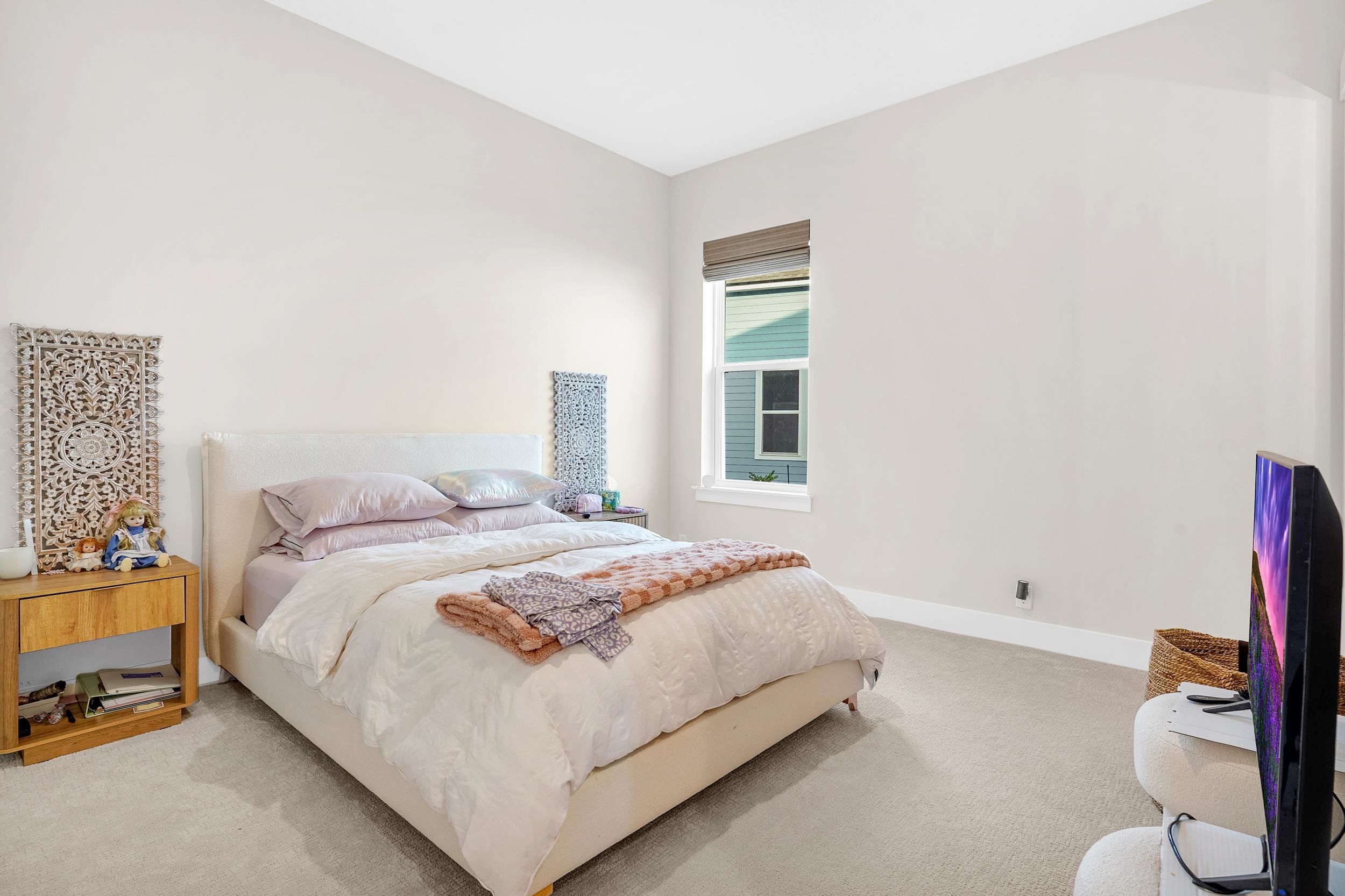 64 Oak Cluster Lane St. Augustine, FL 32092 - Photo 31 of 59 a bedroom with a bed and a window