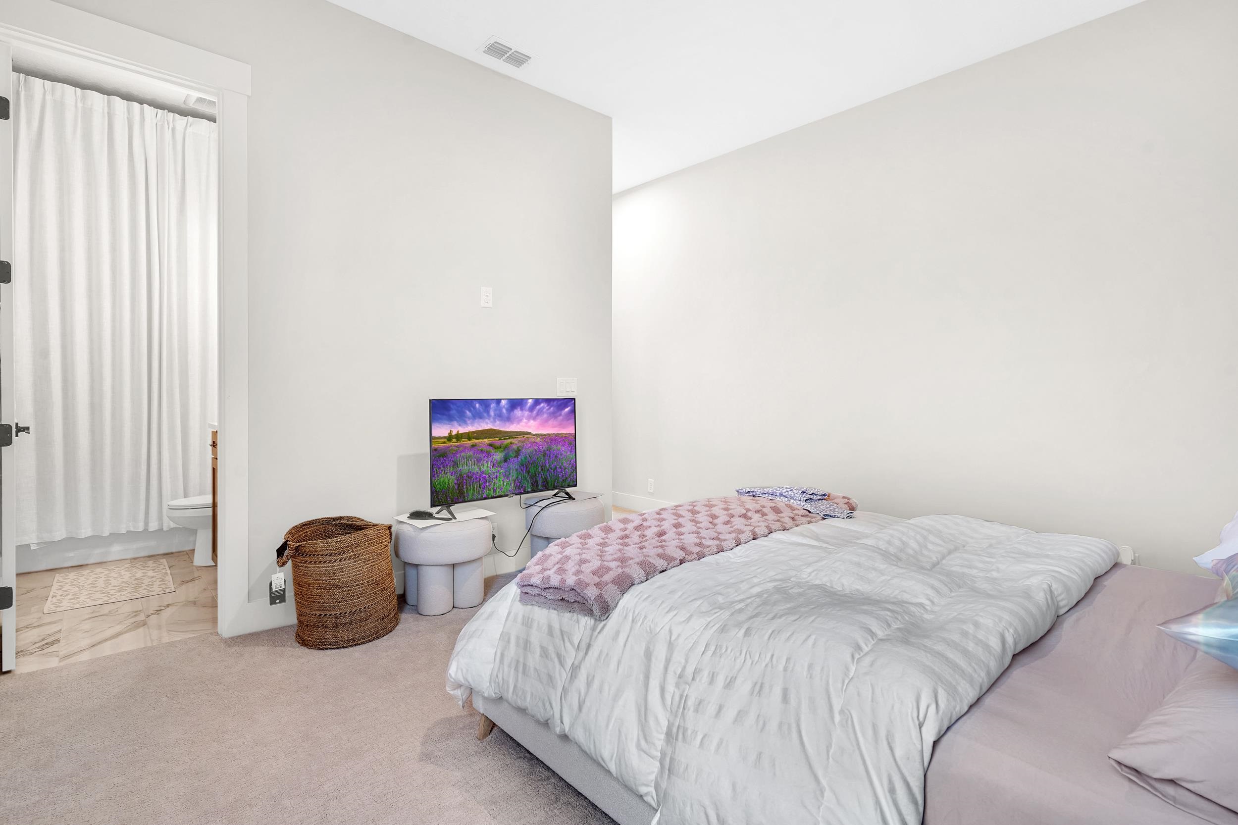 64 Oak Cluster Lane St. Augustine, FL 32092 - Photo 32 of 59 a bedroom with a bed and a window