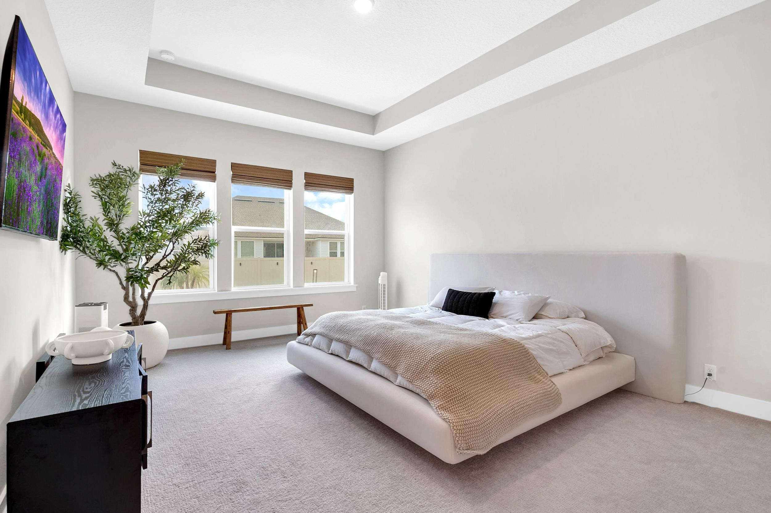 64 Oak Cluster Lane St. Augustine, FL 32092 - Photo 35 of 59 a bedroom with a bed chair and window