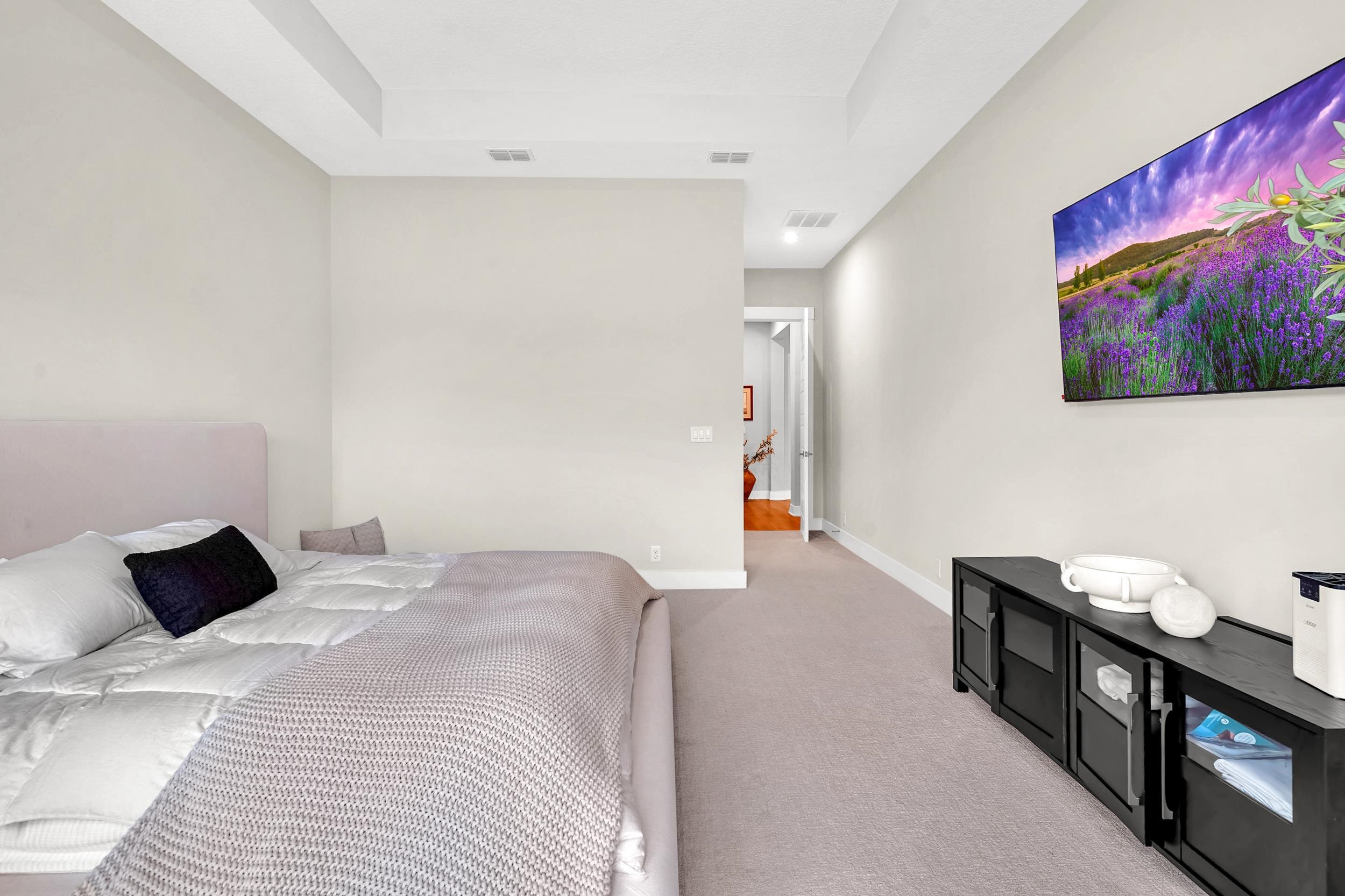 64 Oak Cluster Lane St. Augustine, FL 32092 - Photo 36 of 59 a bedroom with a bed and a view of kitchen